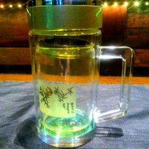 Art glass unique portable drinking ware, thermos and strainer.